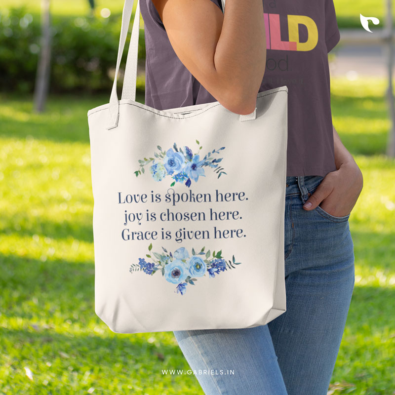 Christian-Tote-Bag-3_Love-is-spoken-here_joy-is-chosen-here_Grace-is-given-here_a.jpg Love is spoken here | Christian Tote Bag Zipper - Image 1